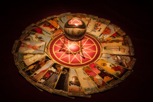 Tarot cards and crystal ball.